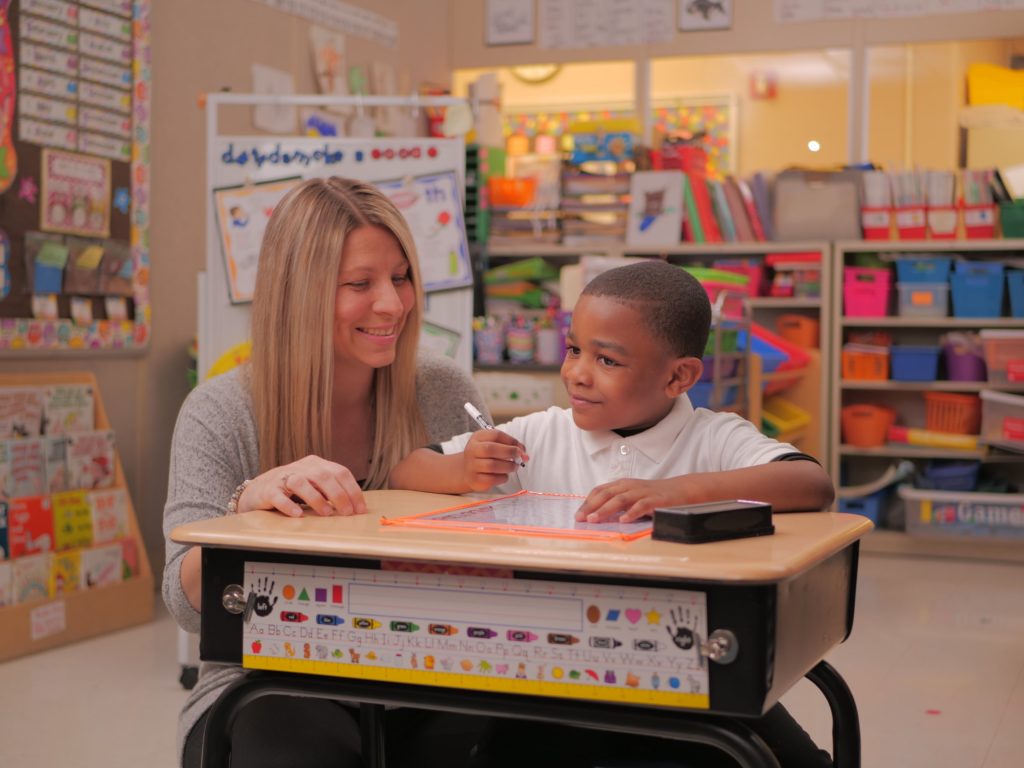 YCS Student and Teacher Smiling Together